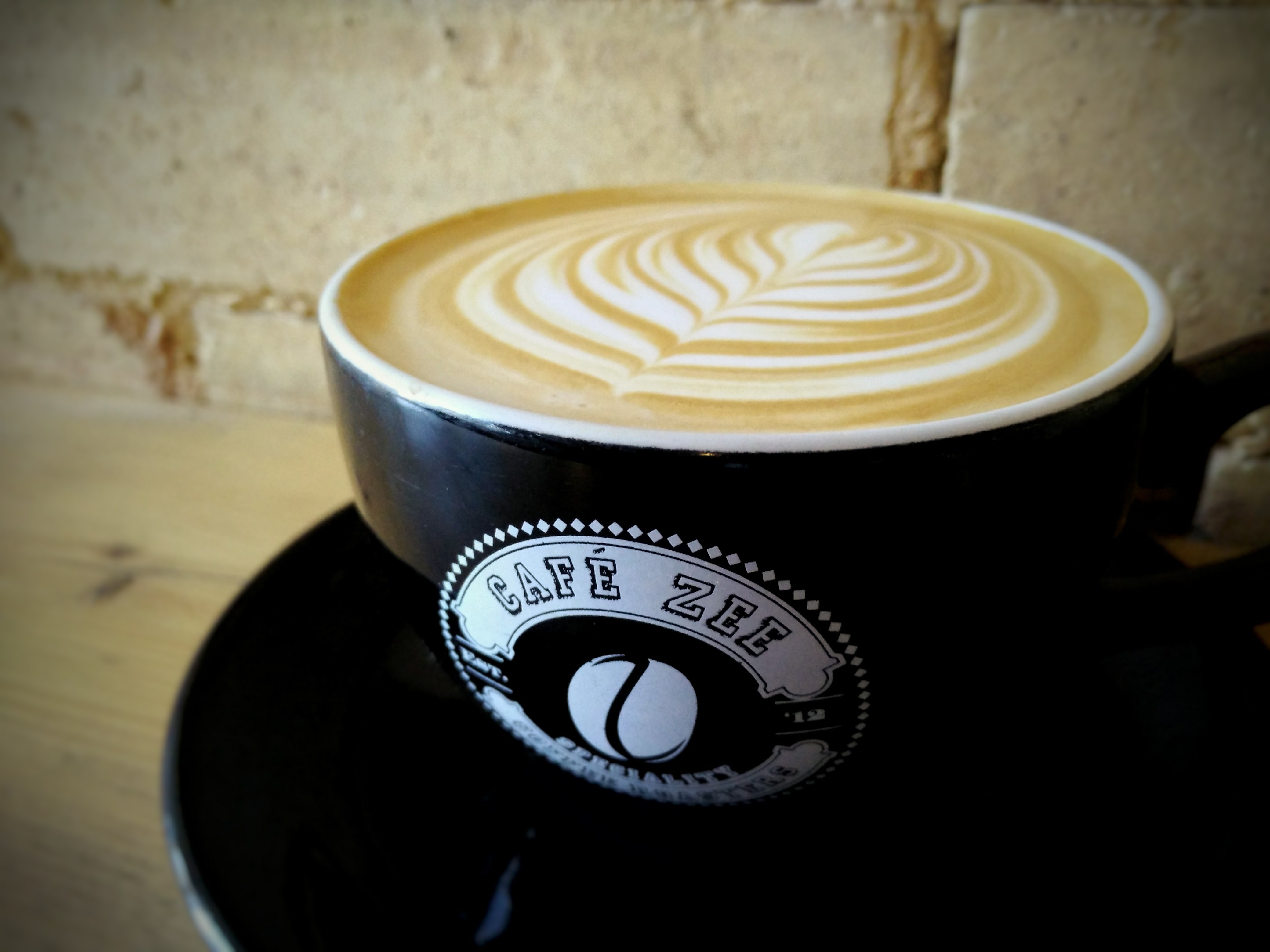 Latte art in Cafe Zee venue, enhancing events with quality coffee and networking.