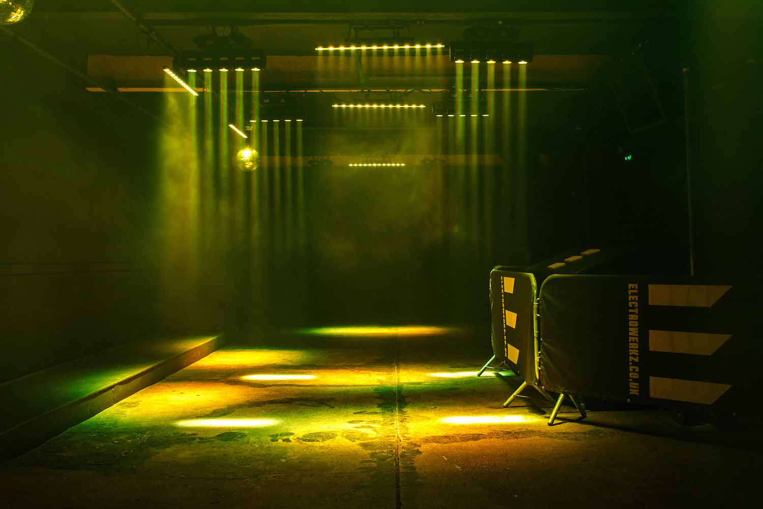 Industrial venue concert, dramatic lighting, Electrowerkz event