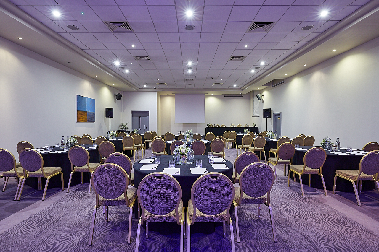 Tavistock meeting space with round tables, ideal for corporate events and presentations.