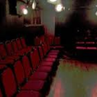 Fringe Theatre setup with red chairs for intimate workshops and conferences in London.