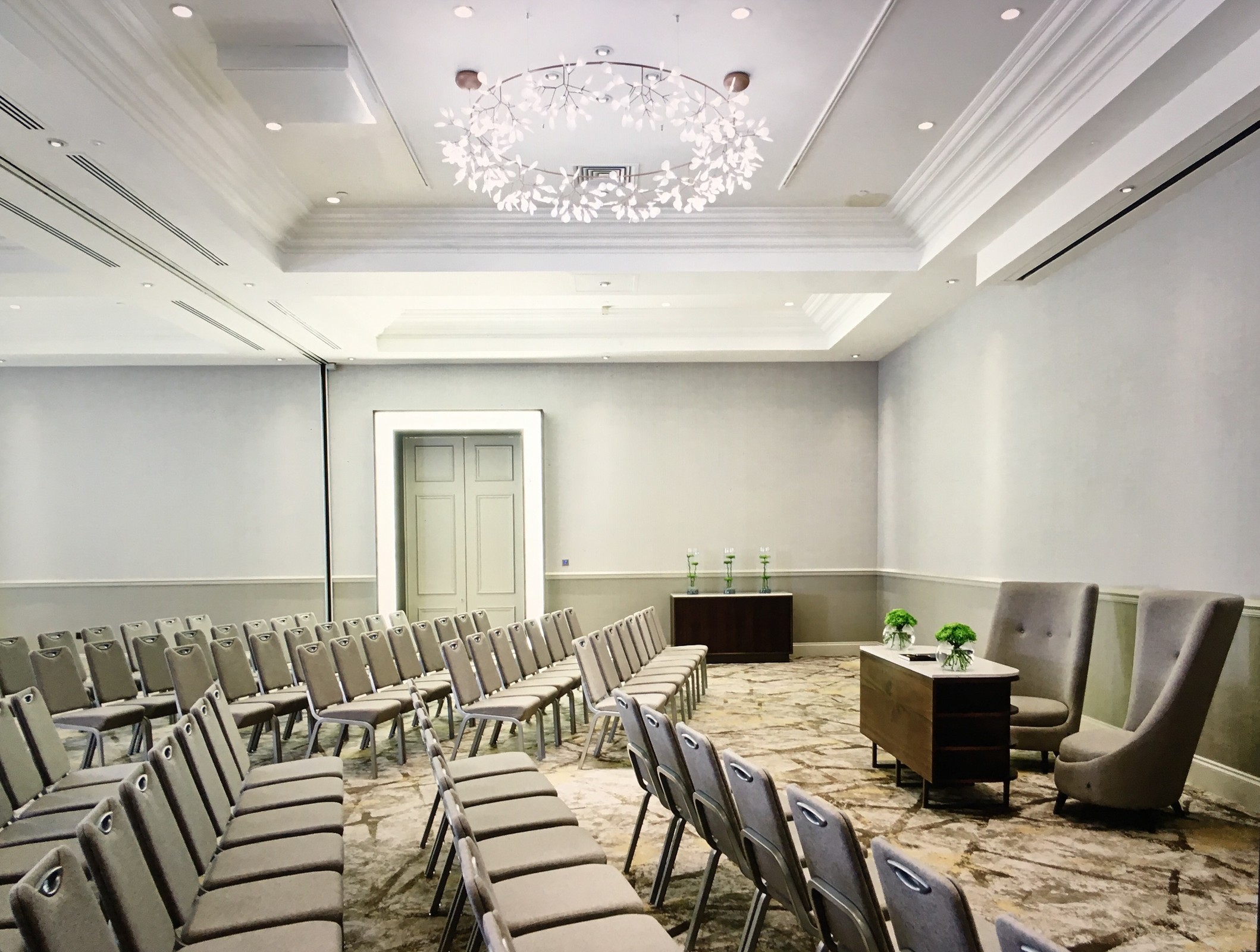 Meeting room at Primrose Hill Marriott, featuring elegant chandelier for workshops and presentations.