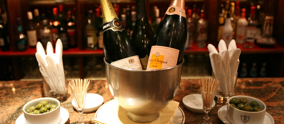 Elegant champagne display in chilled bucket for weddings and corporate galas.