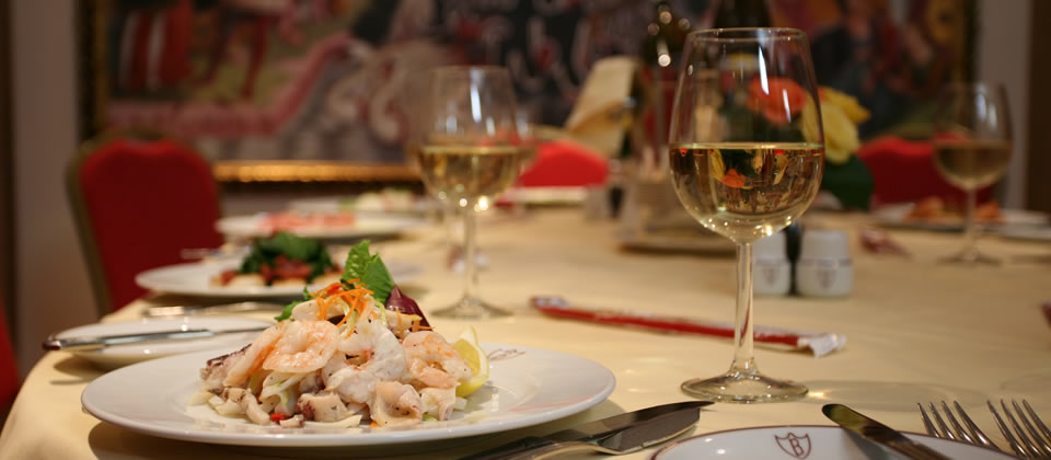 Elegant dining table with seafood salad for corporate events in Bolton's Venetian Room.