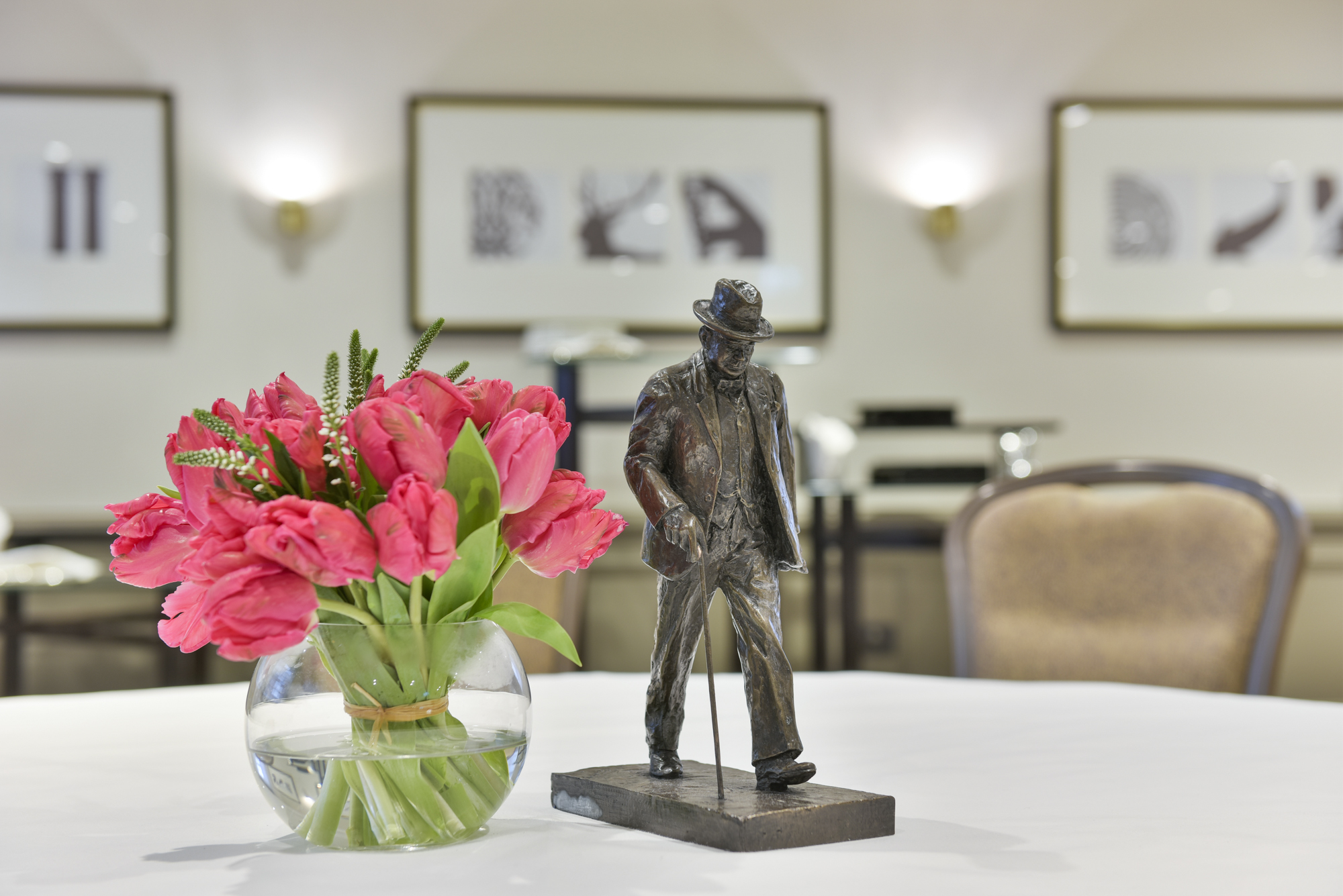 Blenheim Suite at Hyatt Regency London with pink flowers, perfect for meetings and events.