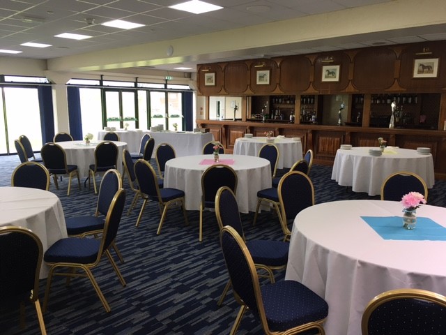 Ardingly Room event space with round tables, ideal for meetings and social gatherings.
