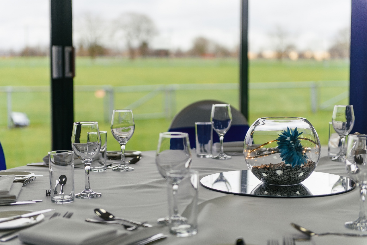 Kleinwort Room dining setup with elegant glassware for corporate events in South England.