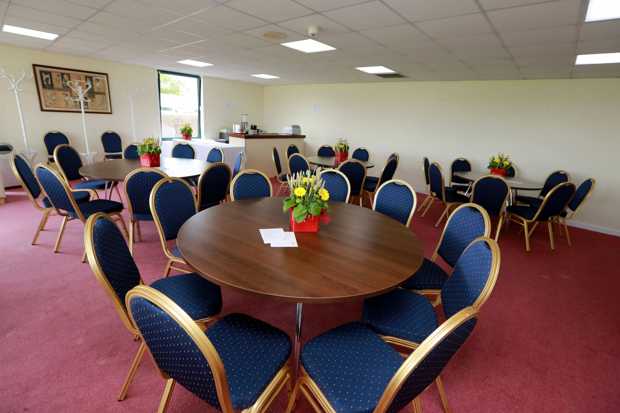 Upper Queens Room with round tables, ideal for workshops and networking events.