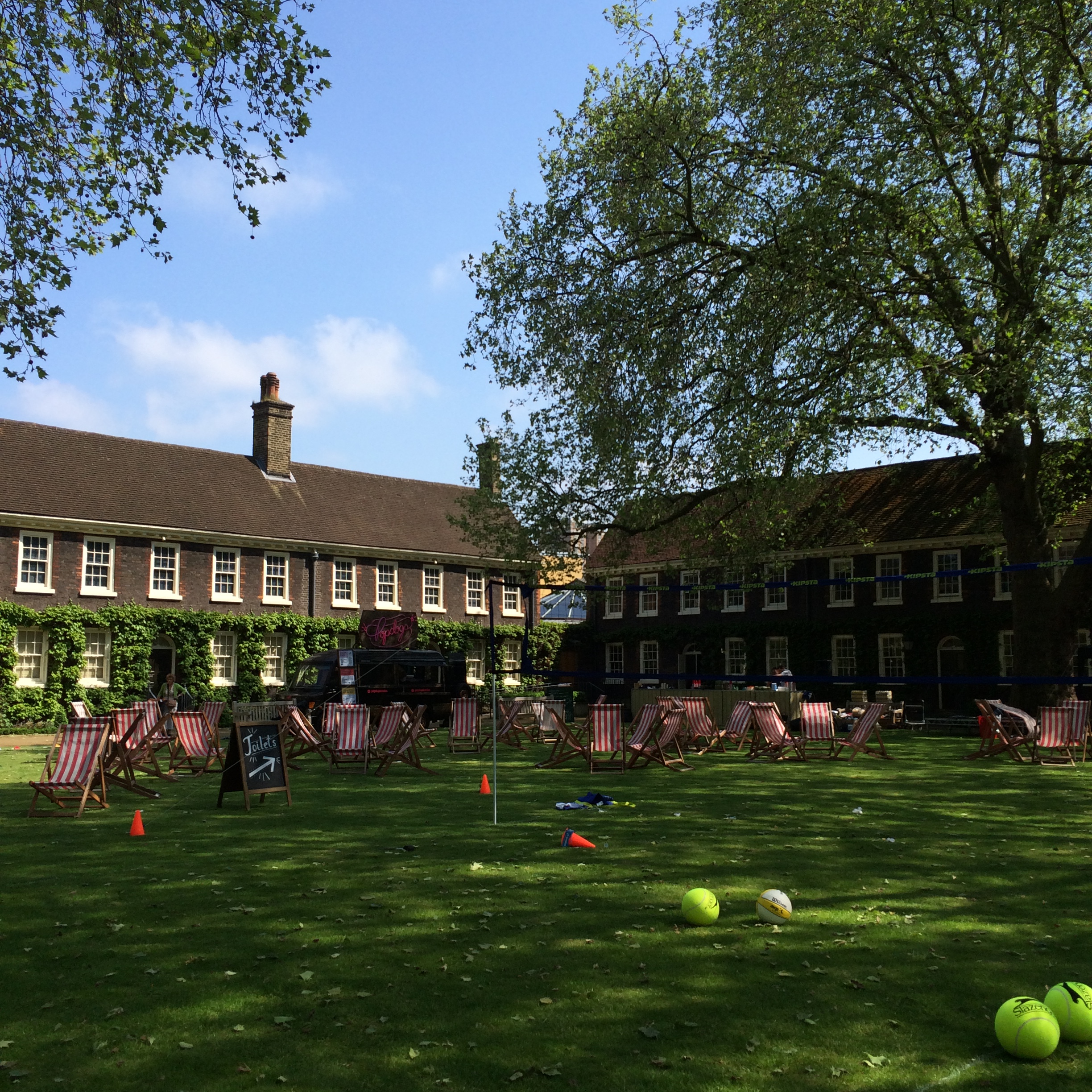 Charming outdoor venue with lush lawn for summer events and team-building retreats.