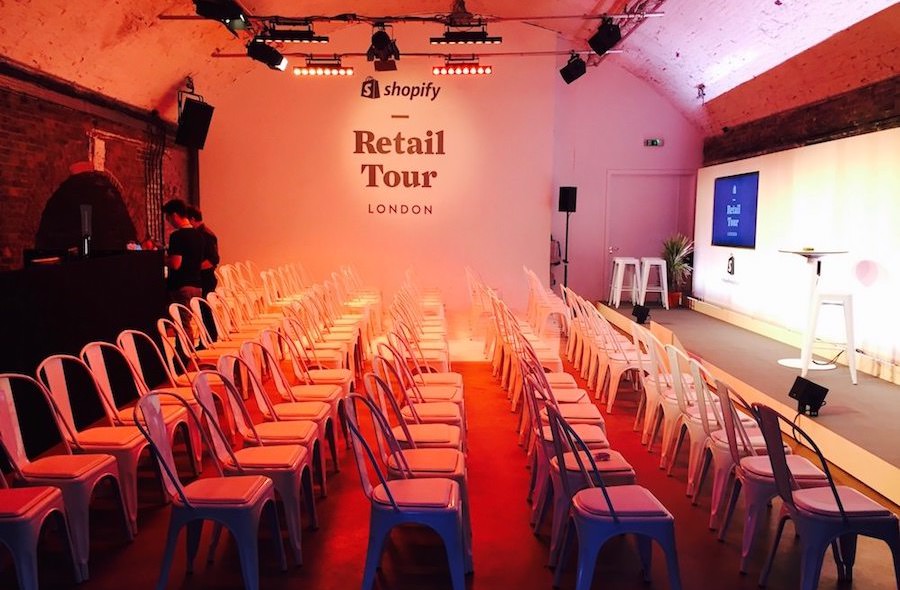Event space in Shoreditch for Shopify Retail Tour, featuring modern setup and white chairs.