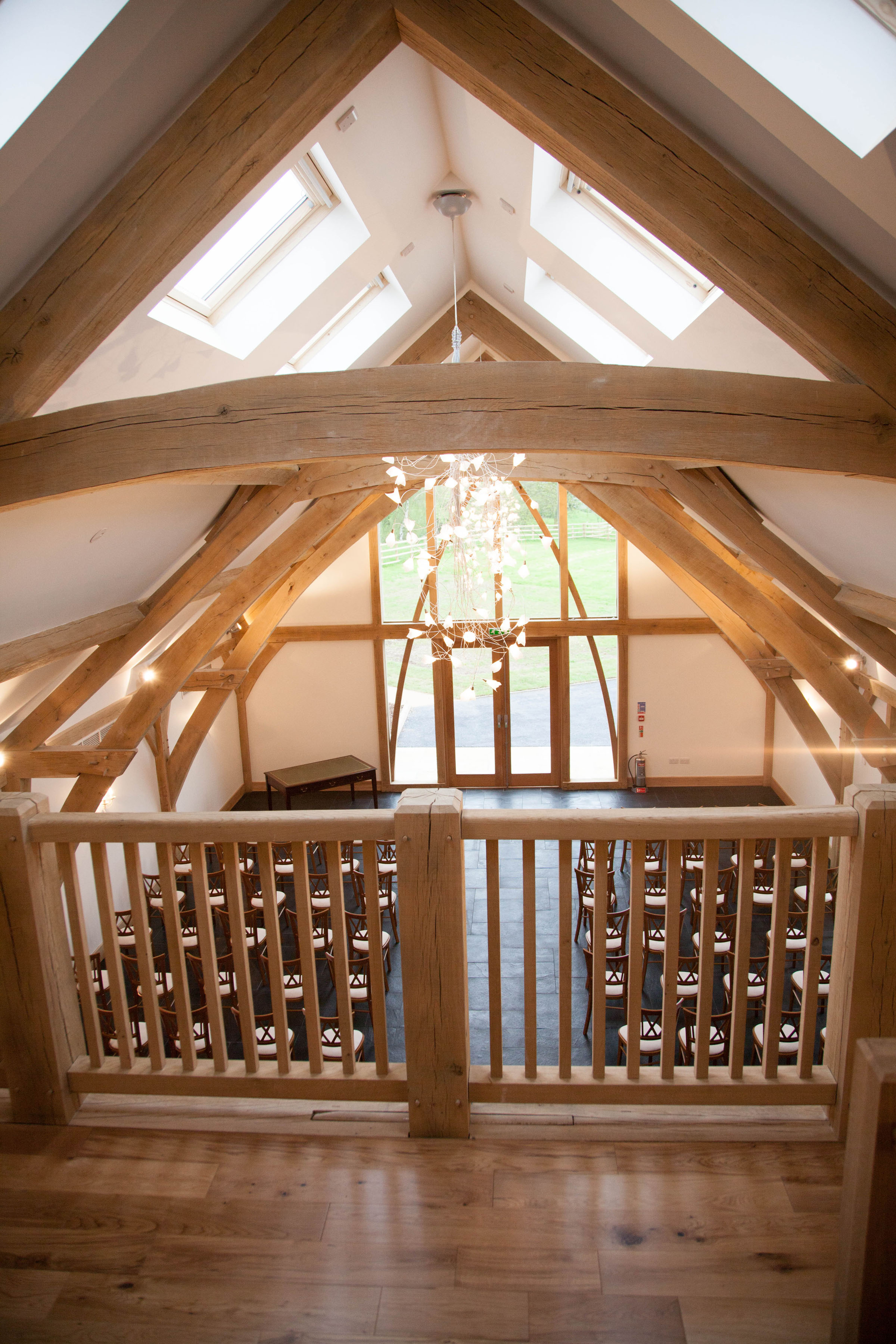 Rustic Oak Barn event space with wooden beams, ideal for weddings and corporate retreats.