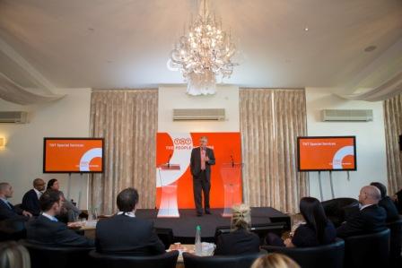 Grain Store event space with speaker, elegant chandelier, meetings and conferences.