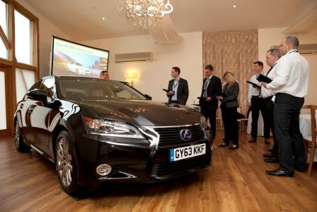Sleek black car at Mythe Barn for innovative automotive product launch event.