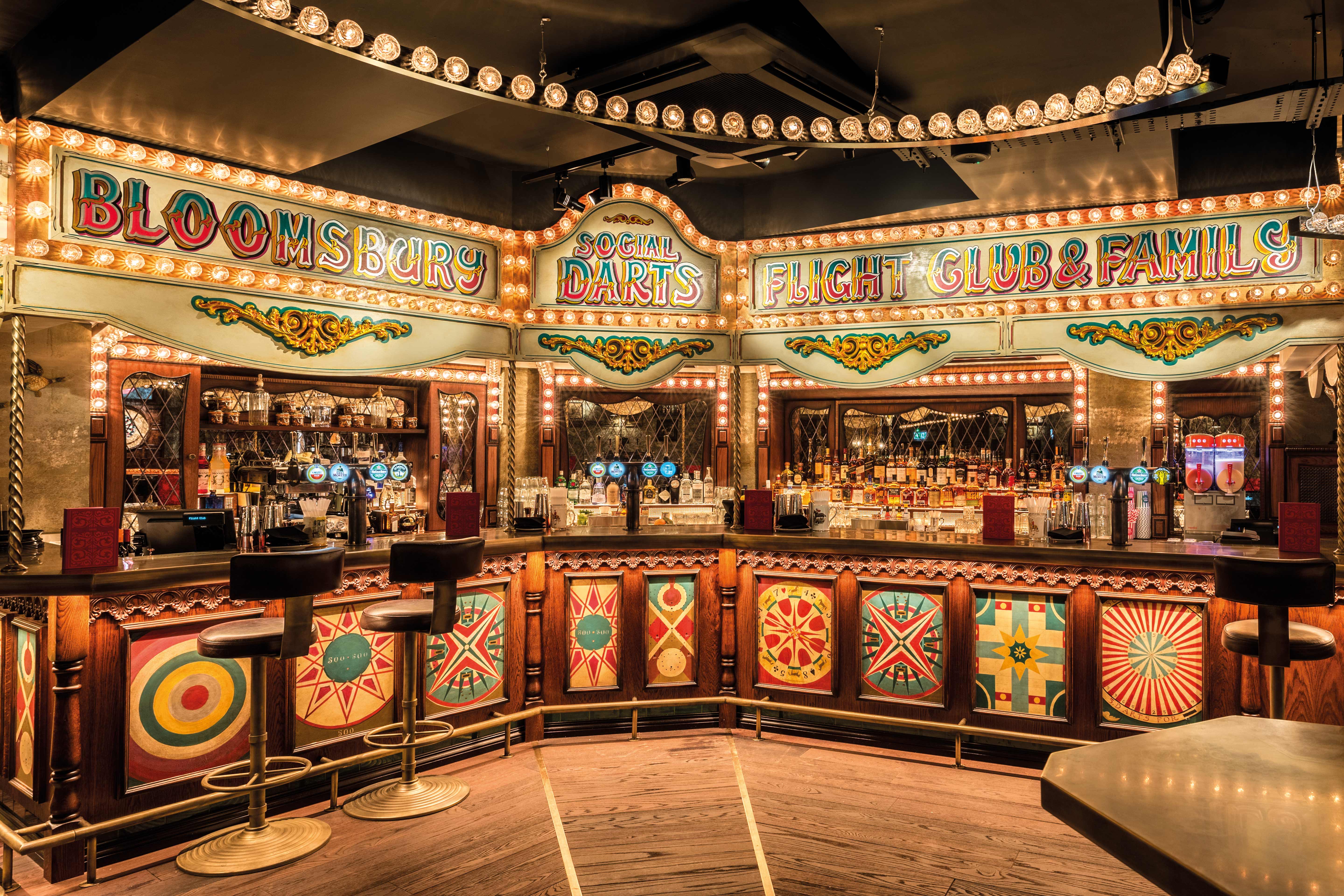 Vibrant carnival-themed bar at Flight Club Bloomsbury for events and parties.