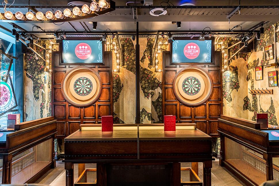 Vibrant event space with dartboards for corporate team-building and social gatherings.