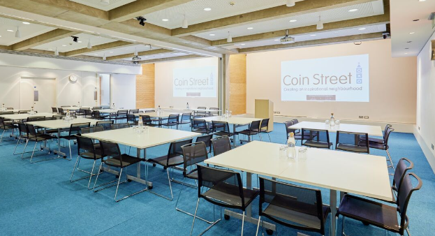 Versatile meeting space with natural light for conferences and workshops at Coin Street Centre.
