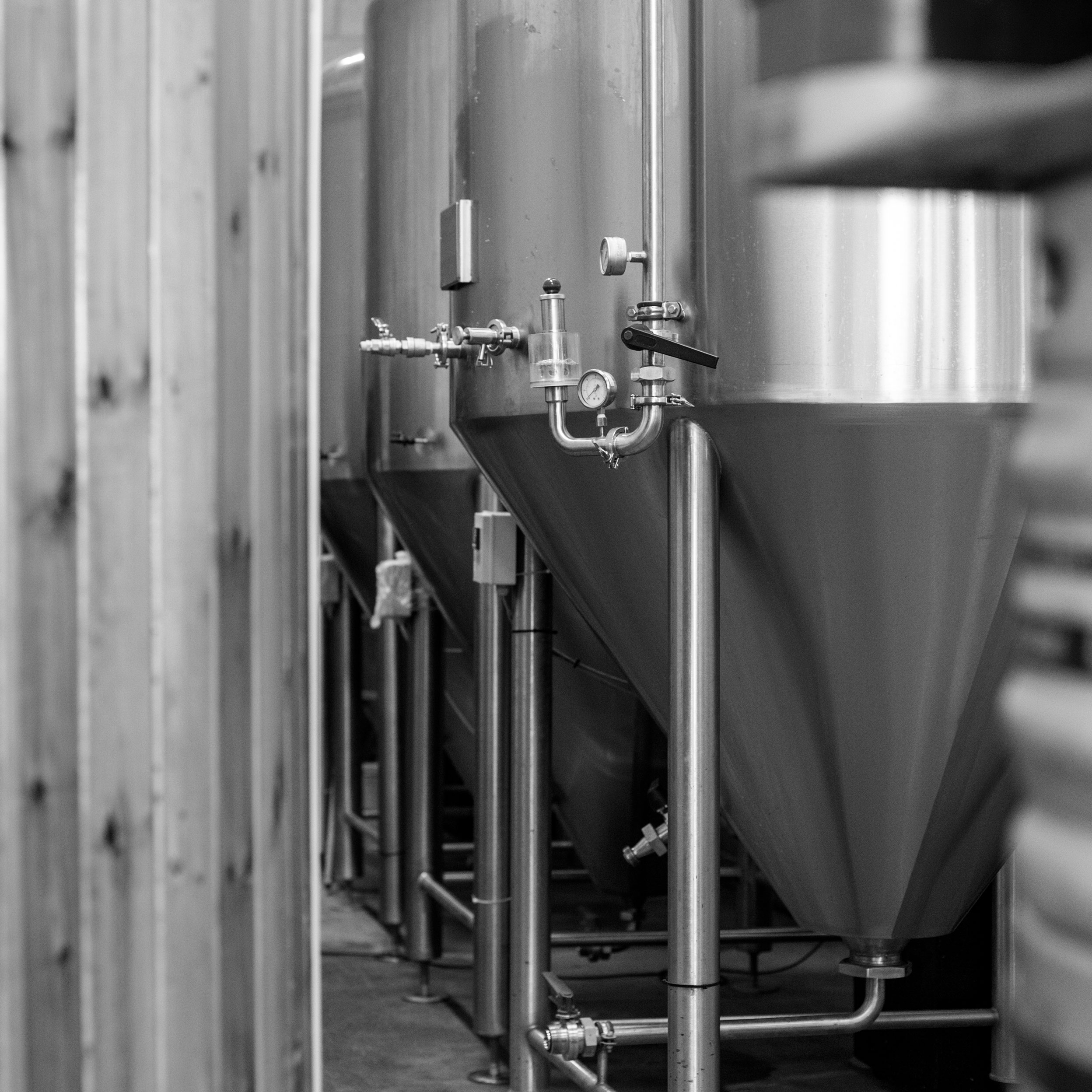 Brewery Tap Room with stainless steel tanks for corporate events and team-building activities.