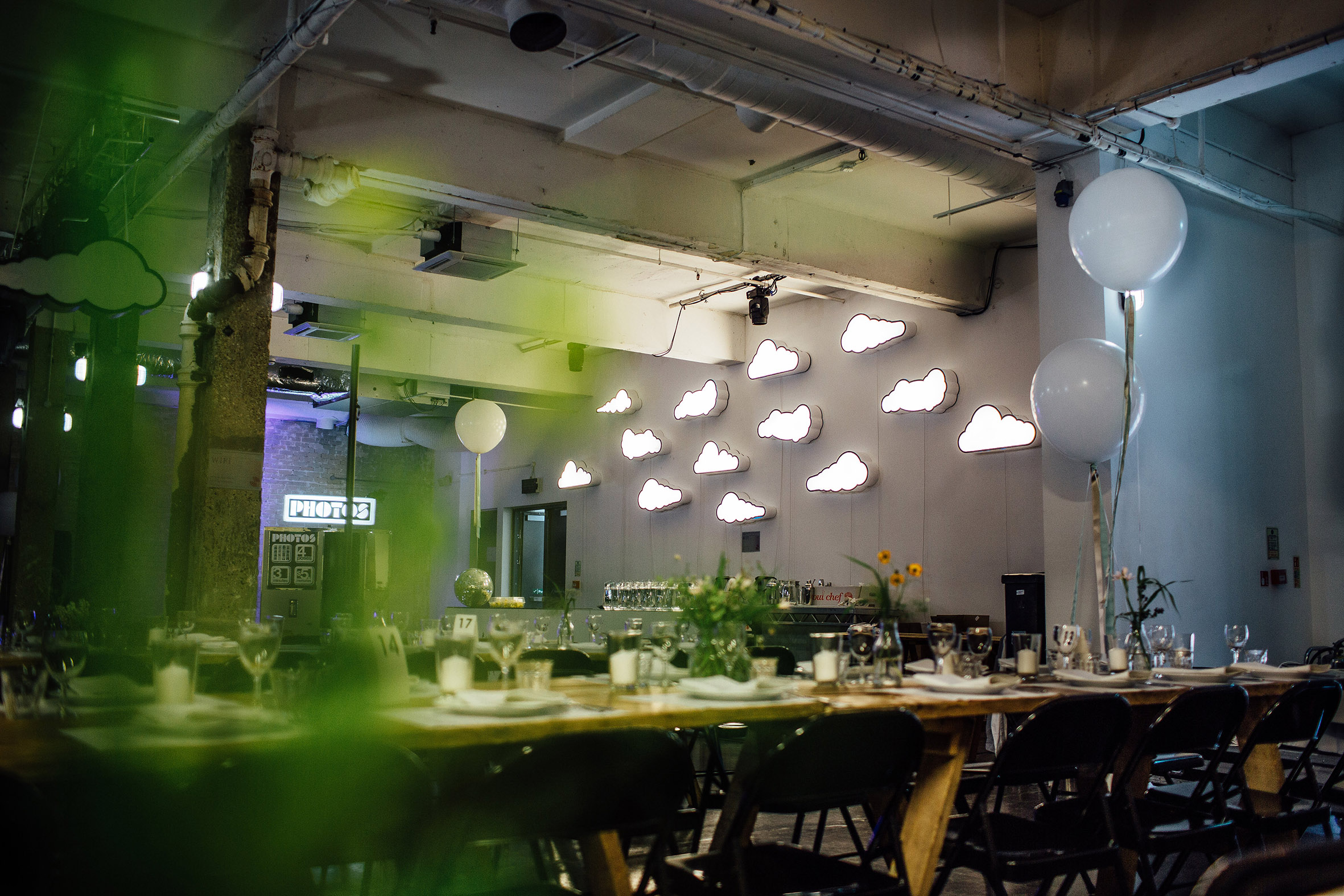 Intimate event space with cloud lighting, perfect for corporate gatherings or private celebrations.