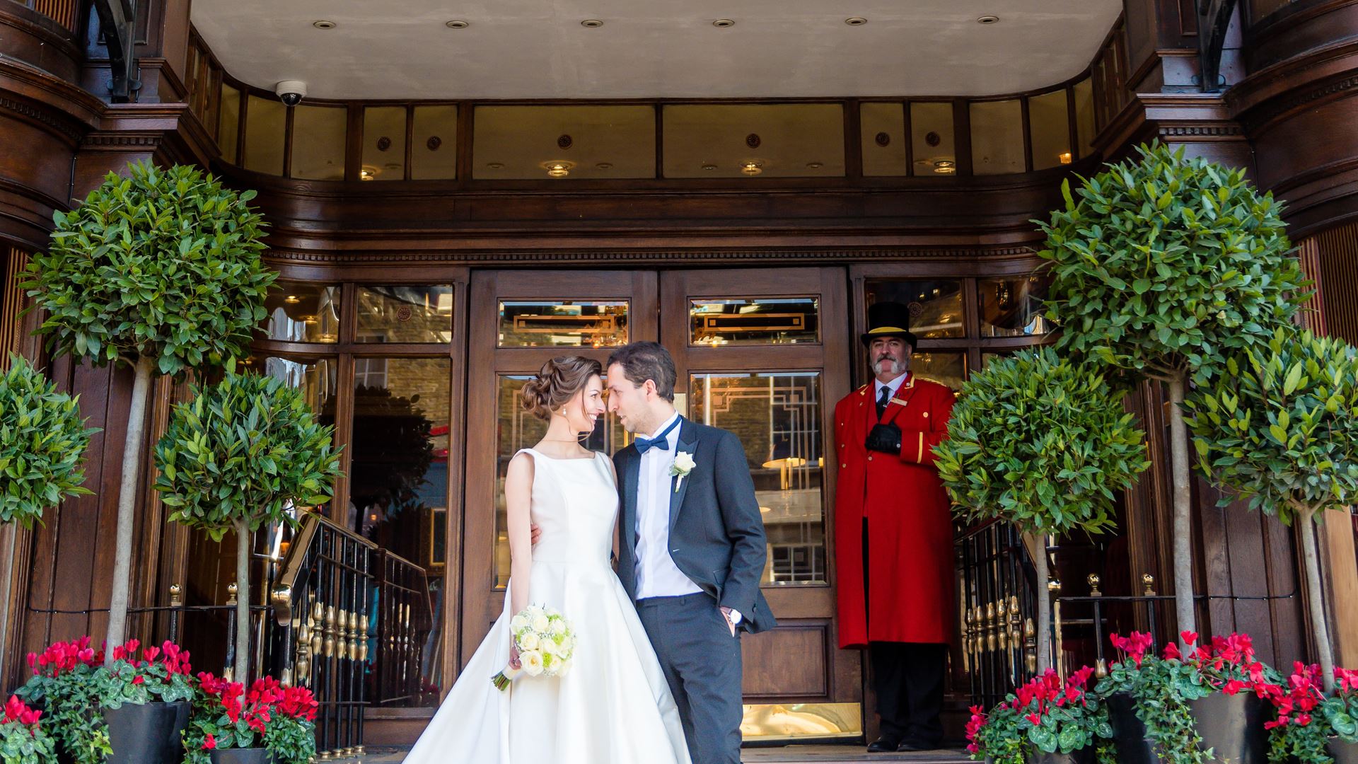 Couple embracing at The Rubens at the Palace, a romantic wedding venue with elegance.