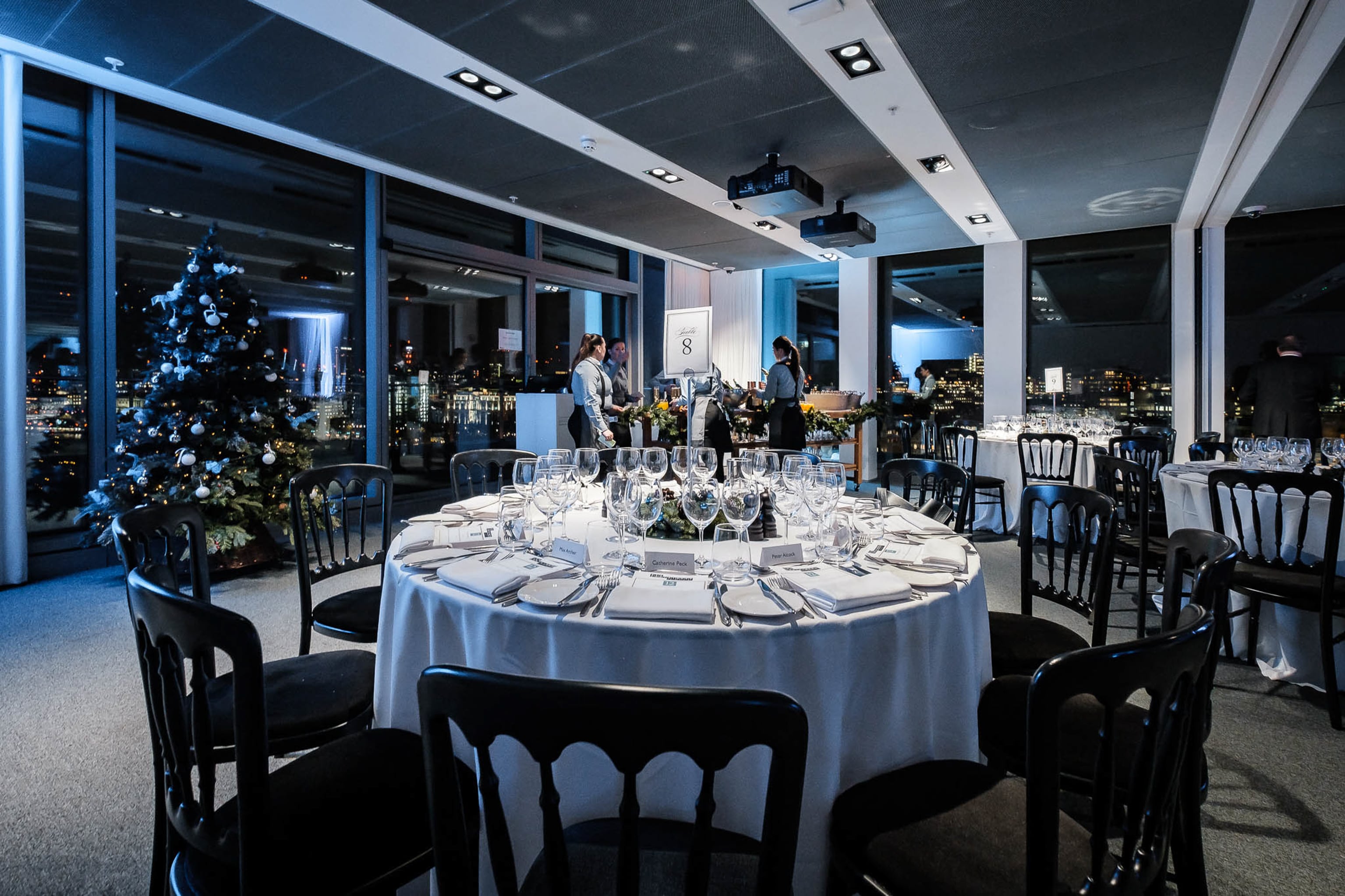 Sophisticated event setup with round table and city views at Sea Containers Events.