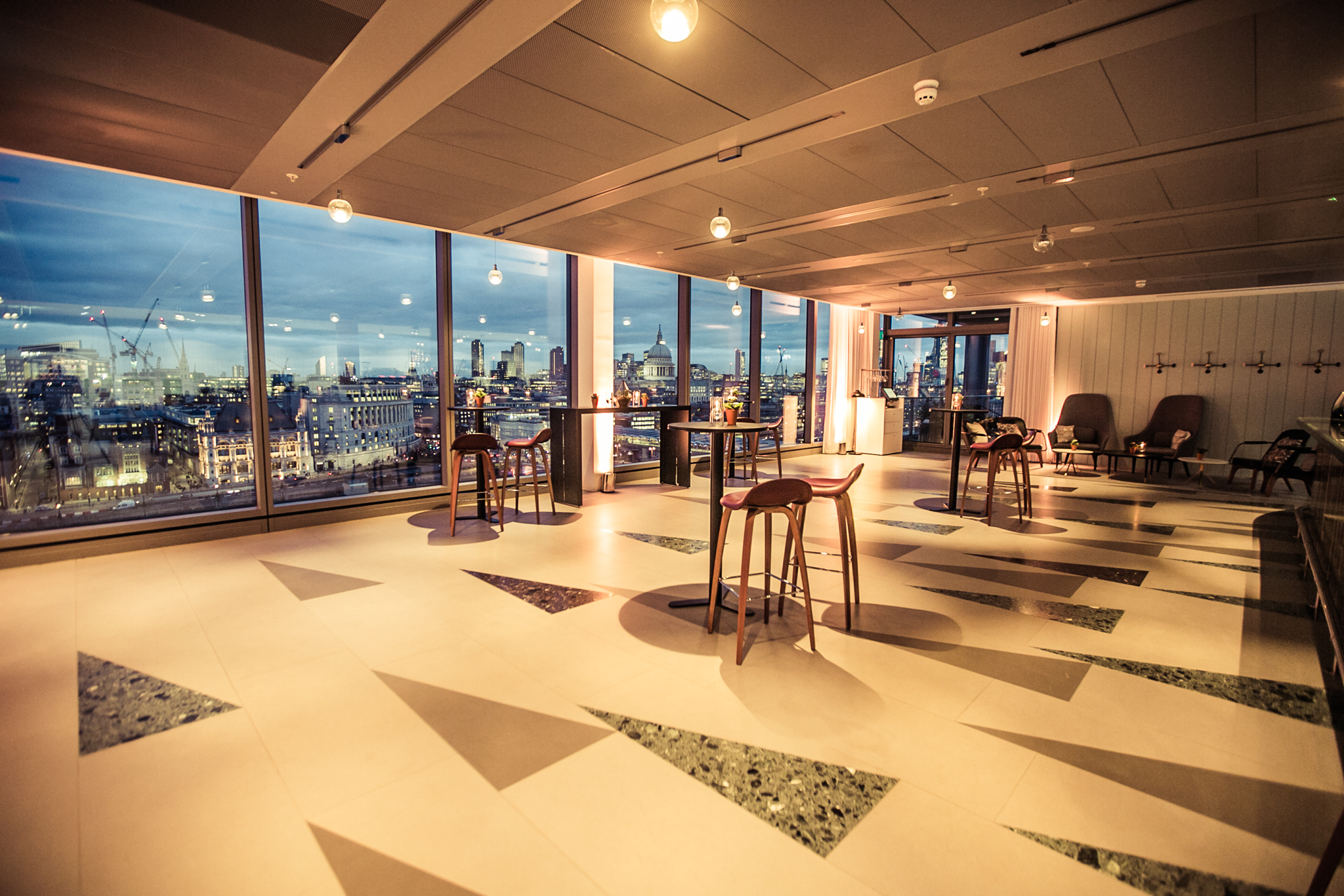 Cucumber event space with city views, ideal for networking and gatherings.
