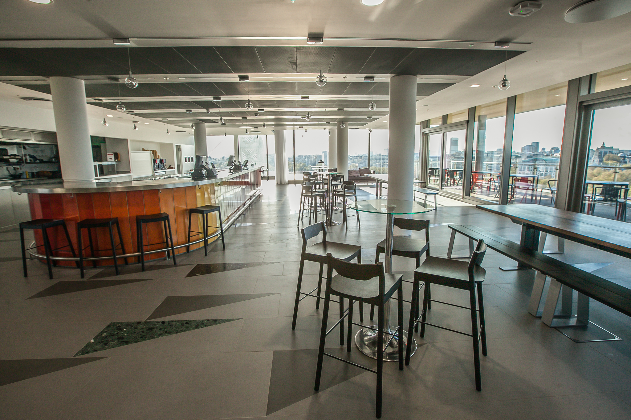 Sunset at Sea Containers Events venue with spacious layout and sleek bar for gatherings.
