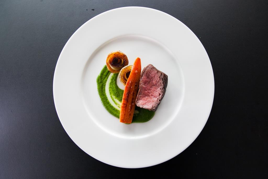 Beef dish with green puree at Cucumber in Sea Containers Events, showcasing culinary excellence.