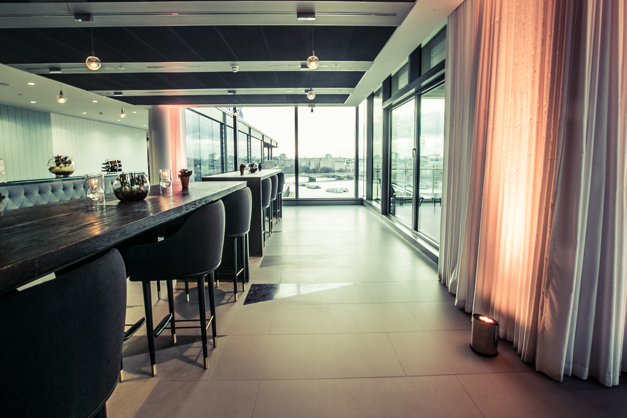 Cucumber event space with stylish bar, ideal for networking and cocktail receptions.