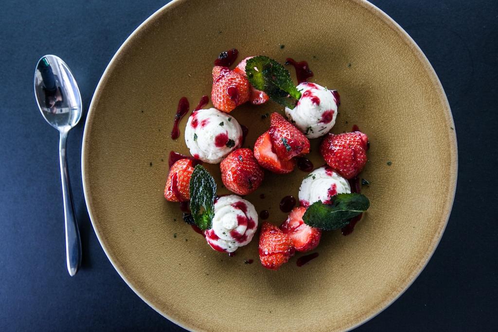 Plated dessert with strawberries and ice cream at Sea Containers Events catering.