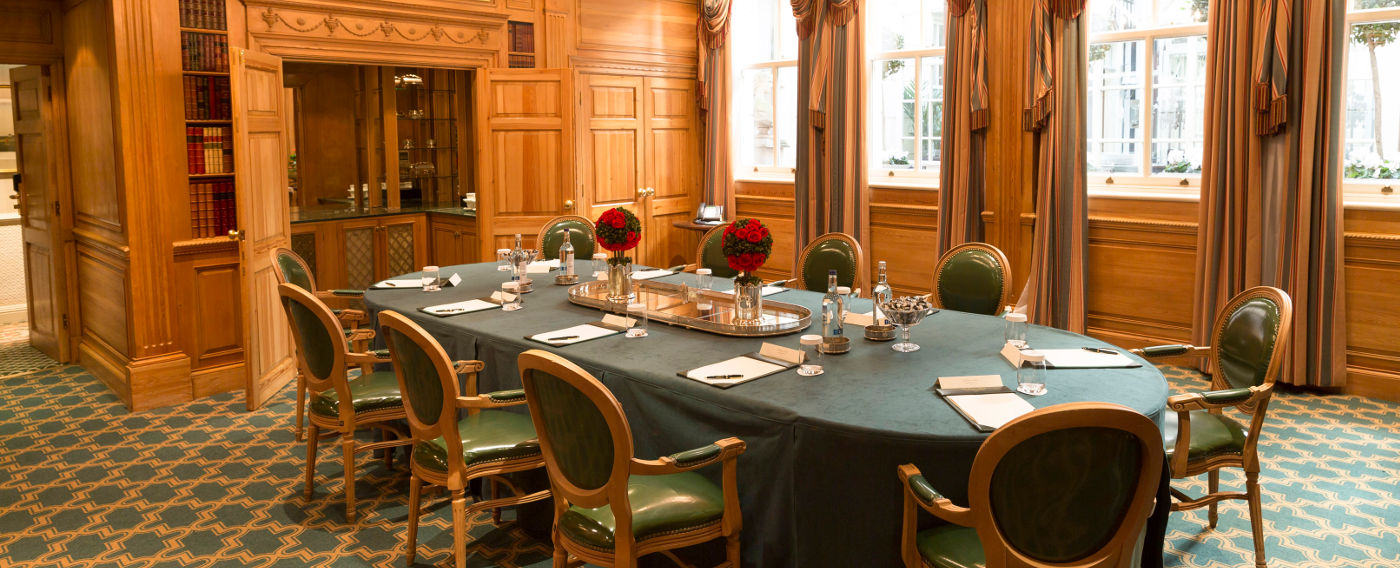 Windsor Suite boardroom with elegant wood paneling for meetings and events.