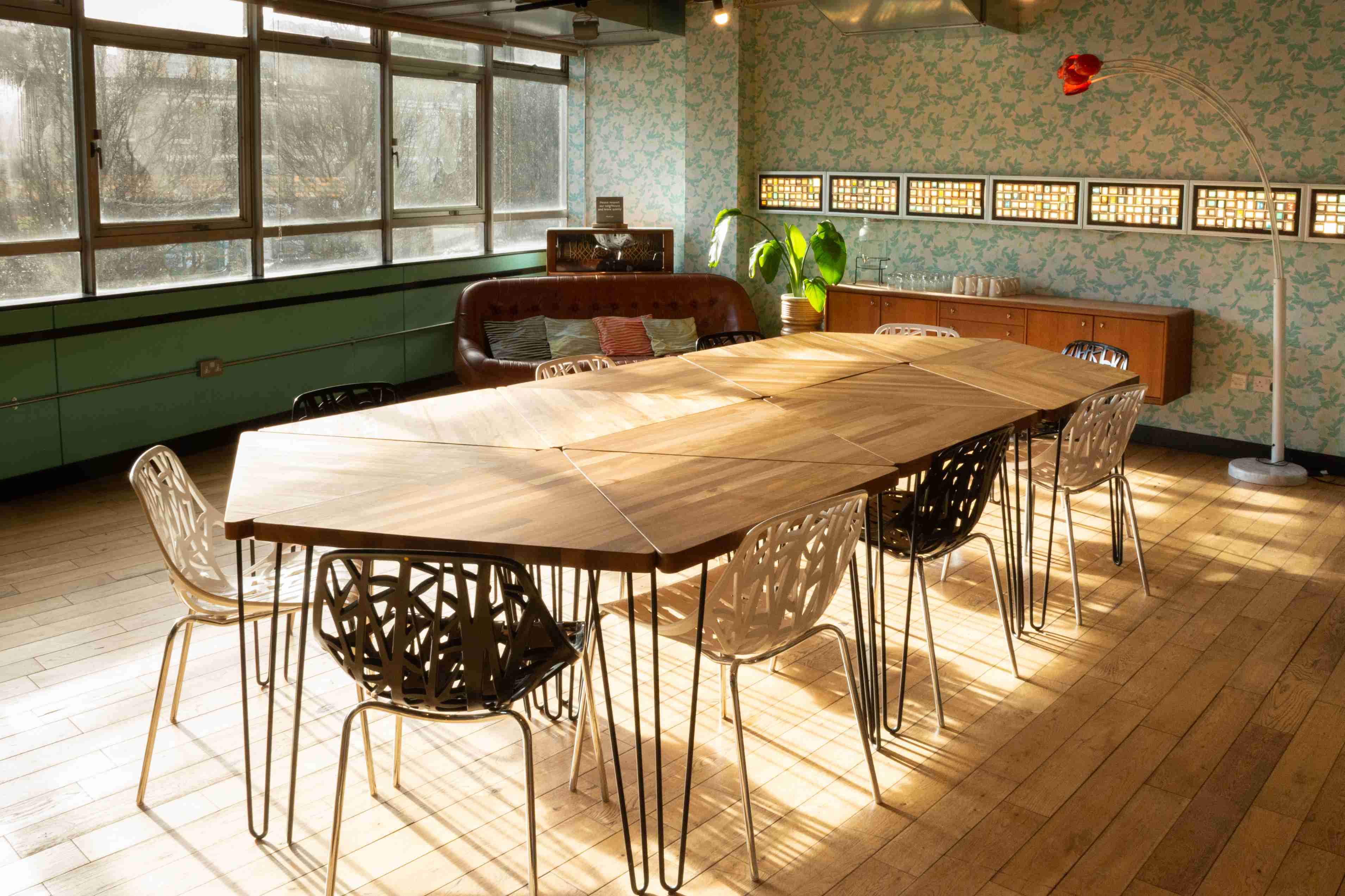Stylish meeting space with elongated wooden table at The Trampery Old Street.