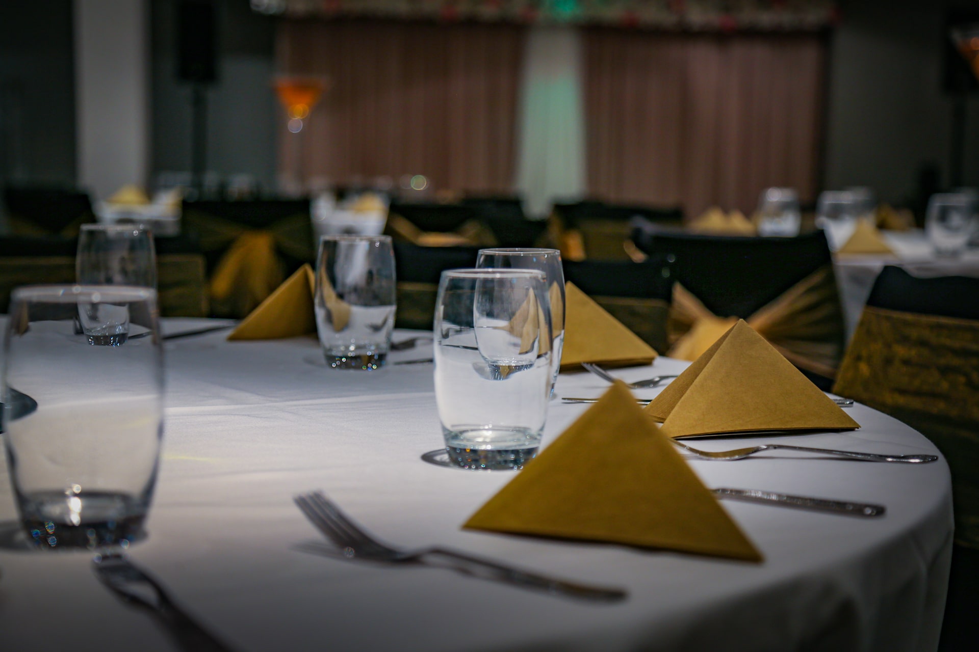 Elegant dining table setup at Mehfil Banquet for corporate events and celebrations.