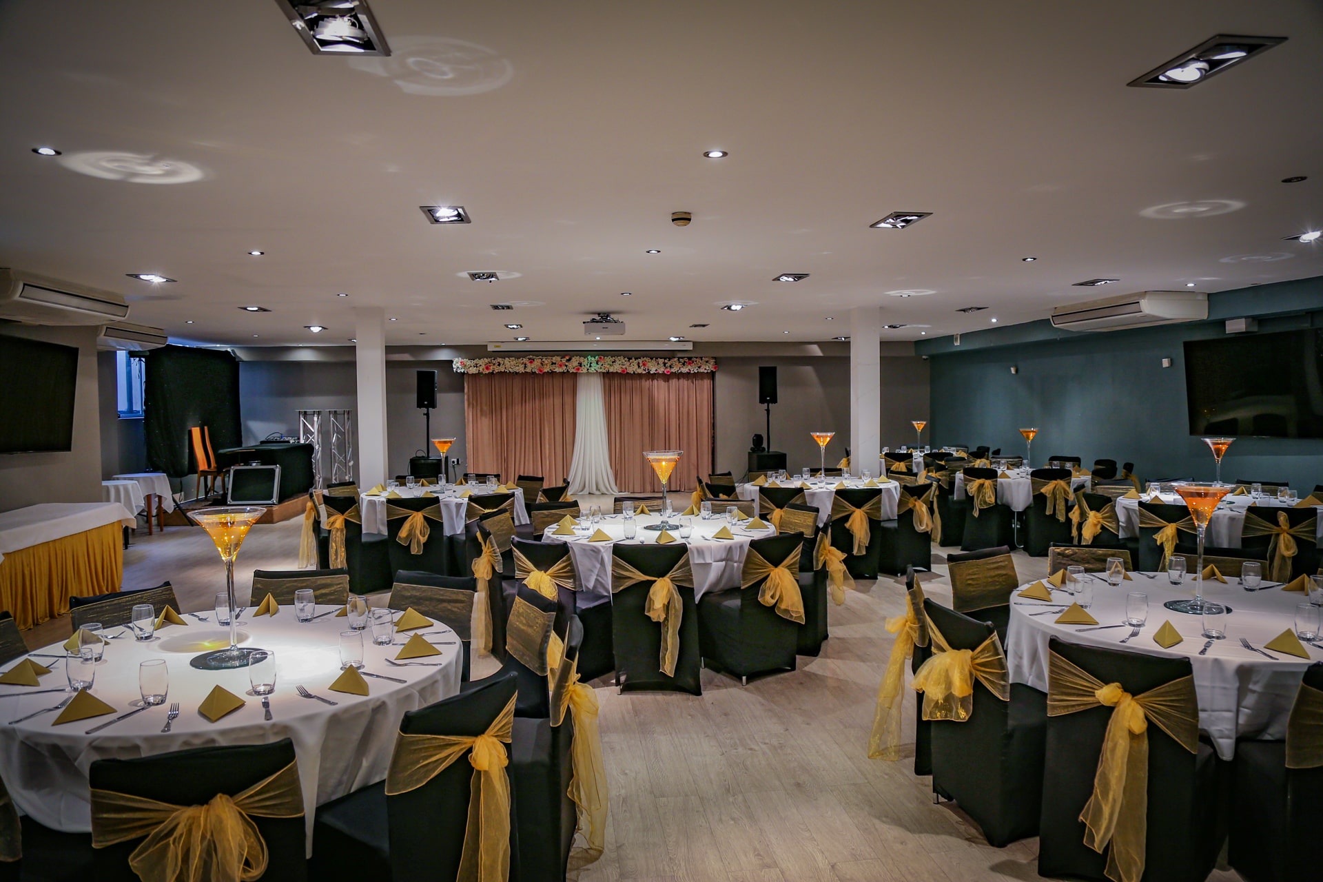 Elegant banquet hall with round tables, perfect for corporate events and gatherings.