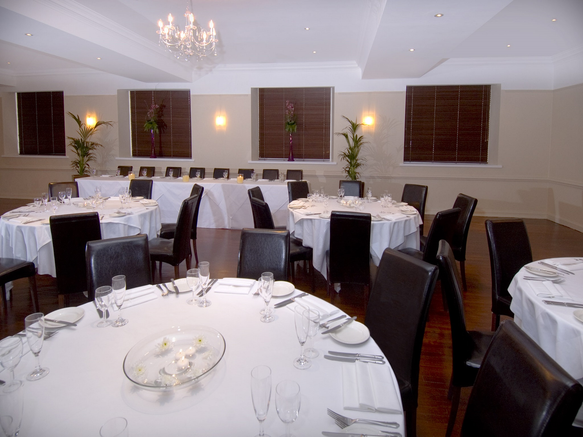 Elegant event space at The Velasco, featuring round tables for banquets and corporate events.