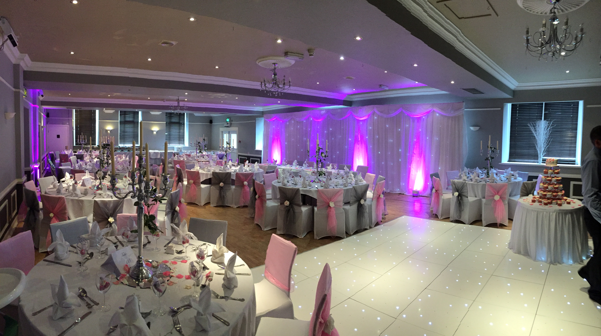 Elegant wedding venue with pink and silver decor at The Velasco, Great Victoria Hotel.