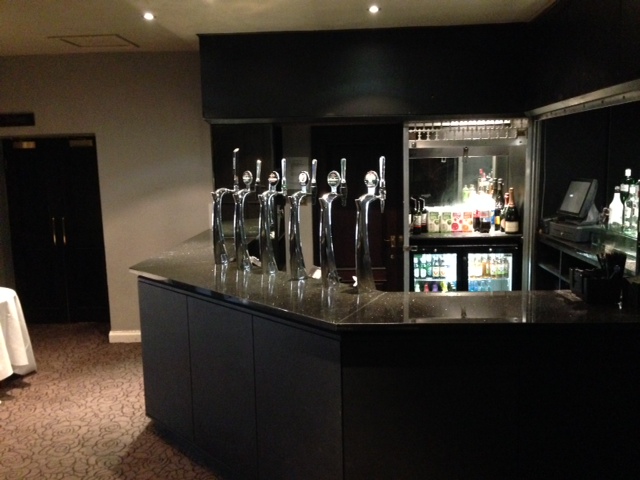 Sleek bar at The Velasco, Great Victoria Hotel for elegant networking events.