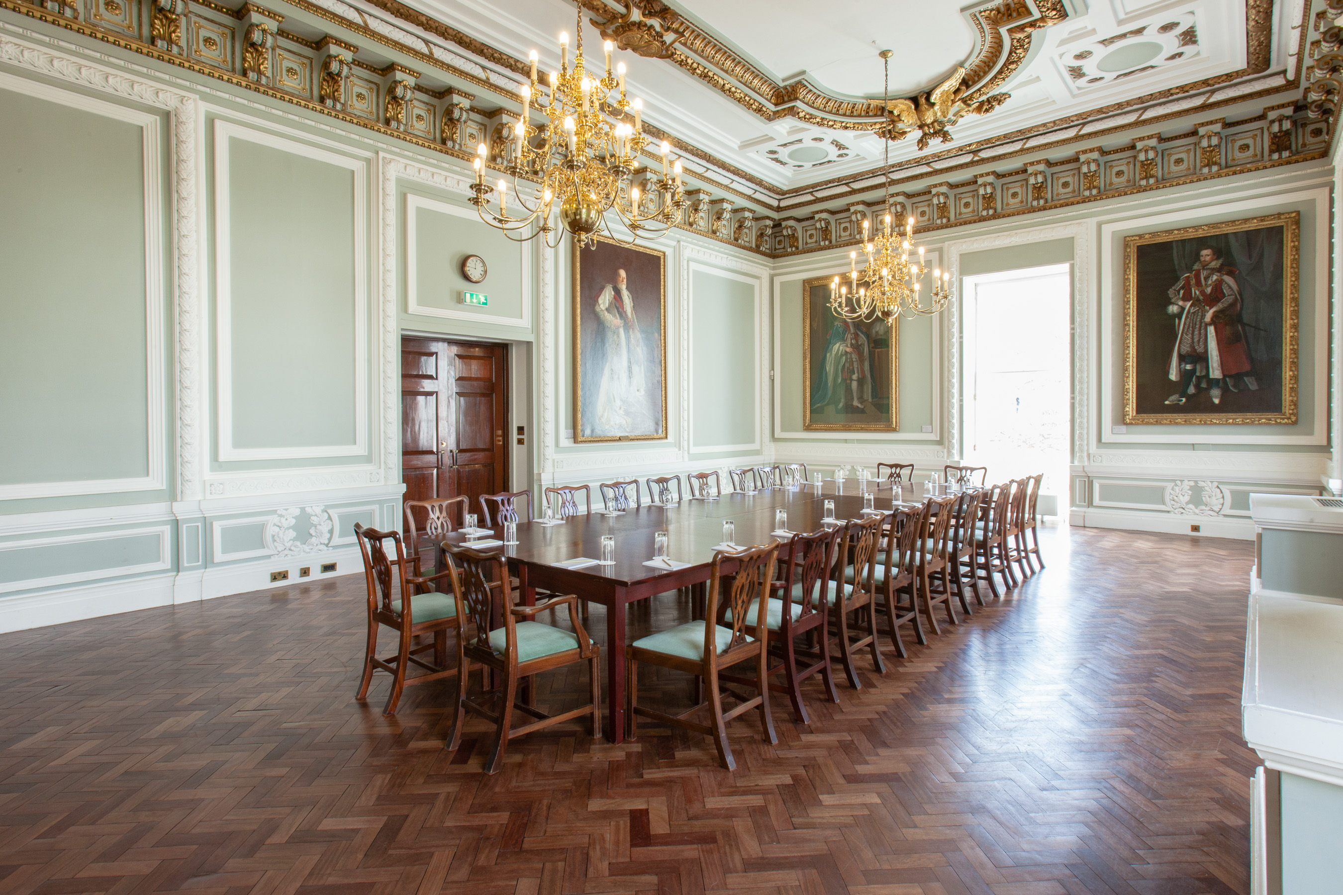 Elegant Council Room with long table, ideal for board meetings and formal events.