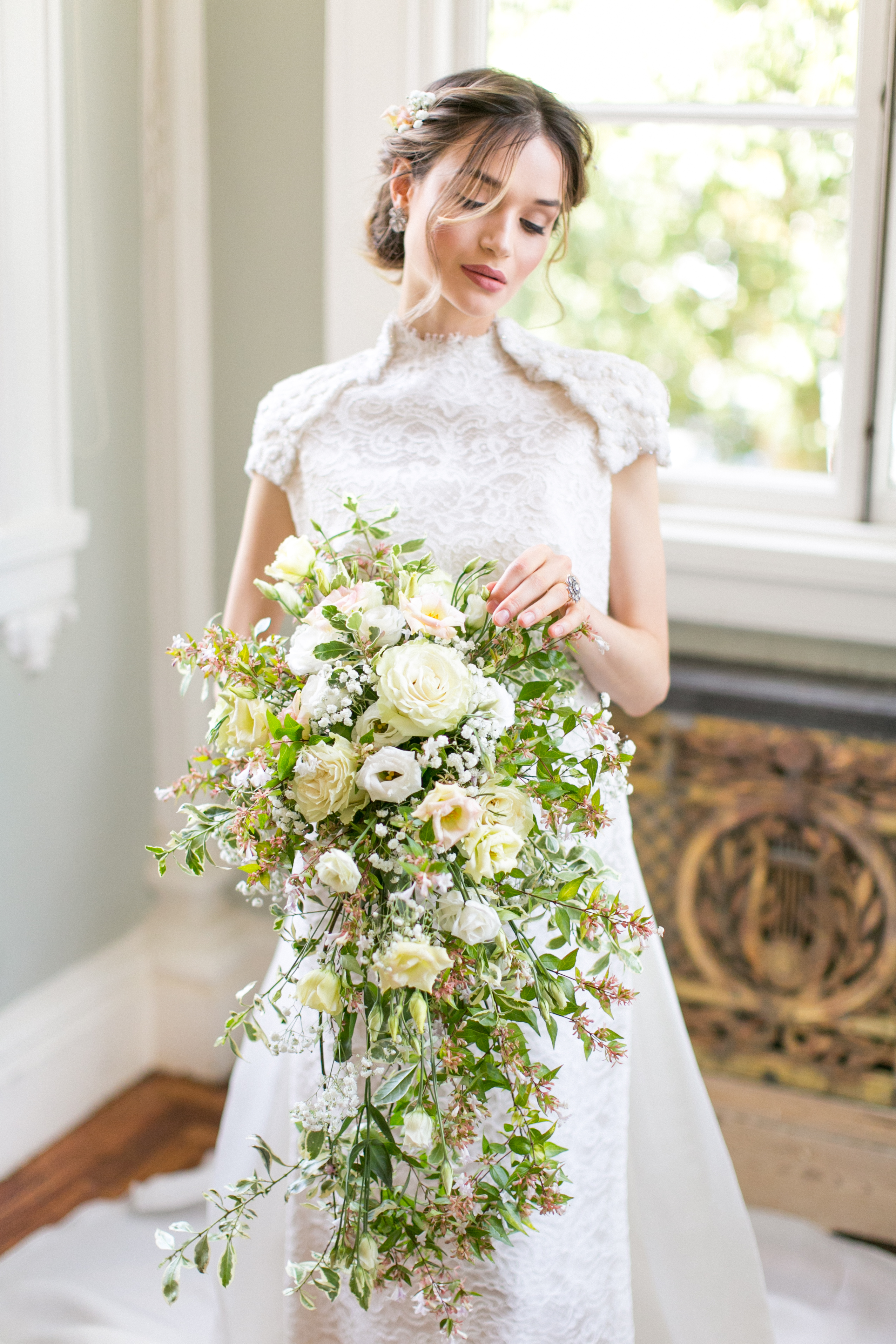 Bride in lace gown at romantic wedding in Council Room, Carlton House Terrace.