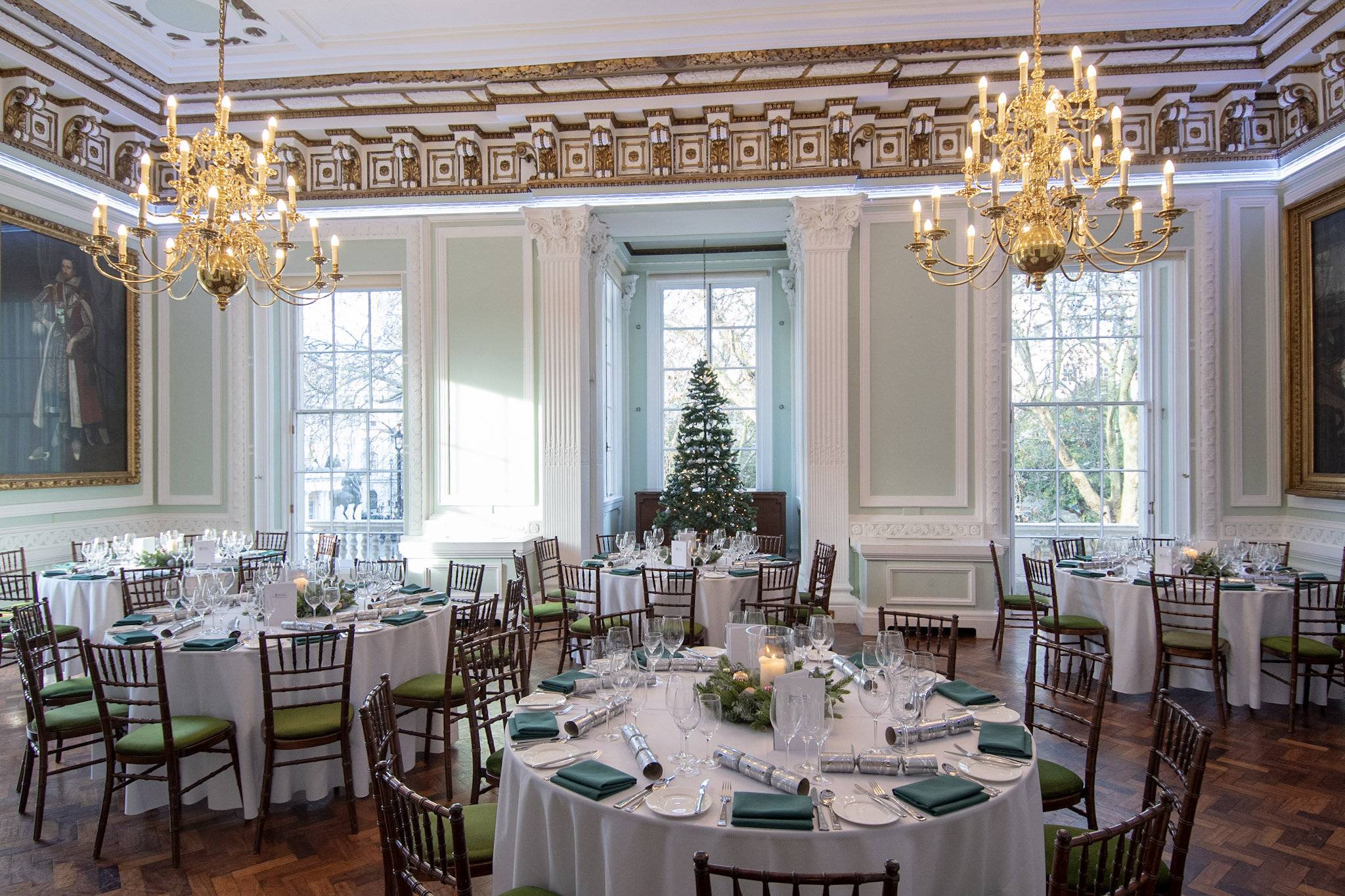 Elegant banquet room with white linens, ideal for corporate events and weddings.