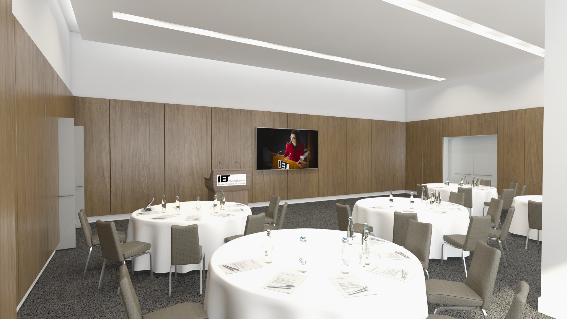 Modern event space with round tables, ideal for meetings and workshops at IET Savoy Place.