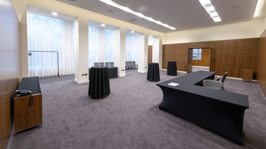 Versatile Haslett Room with natural light, ideal for workshops and networking events.
