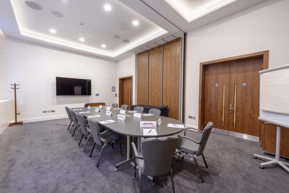 Blumlein Rooms meeting space with round table, ideal for professional events and presentations.