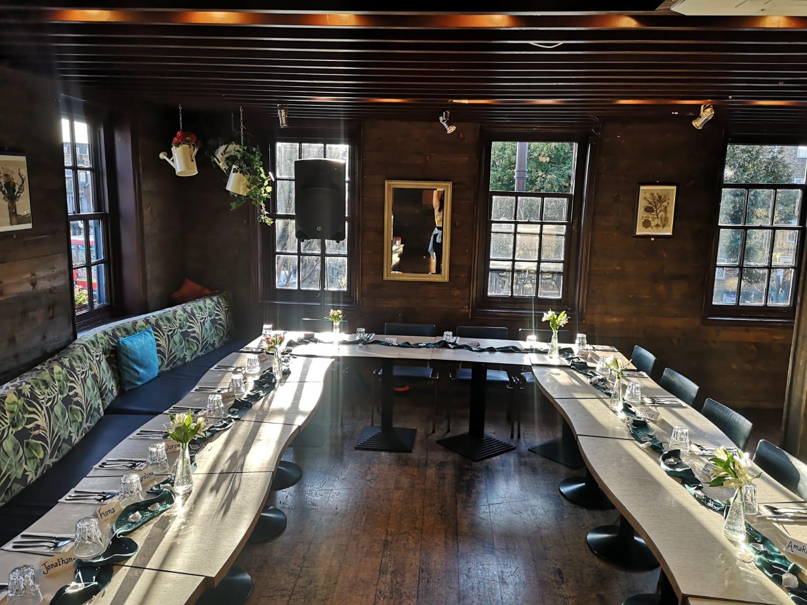 Main Function Room at The Treehouse, elegant meeting space with wooden decor for events.