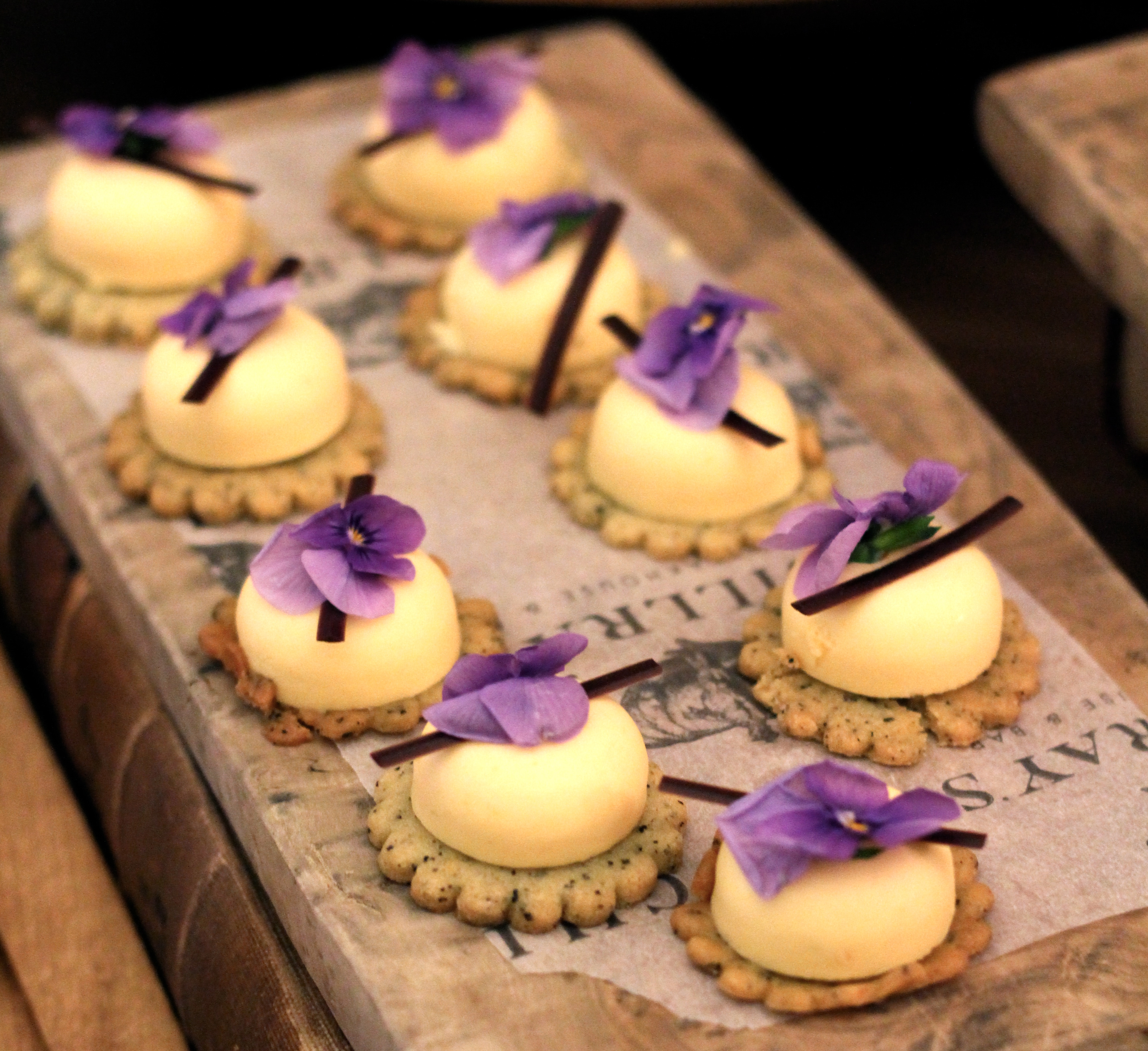 Gourmet desserts with edible flowers at London Marriott Hotel for upscale events.