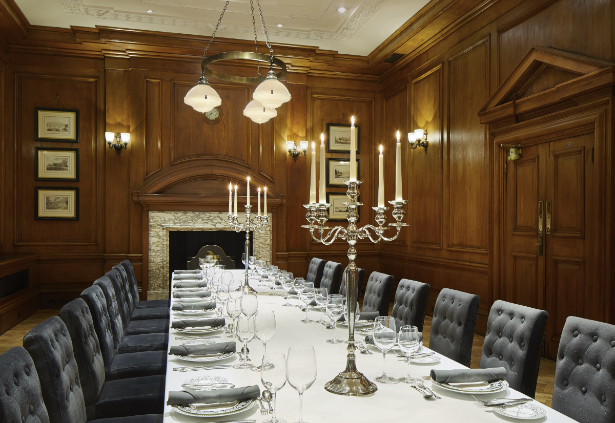 Elegant dining room with fine china for formal events at London Marriott Hotel.