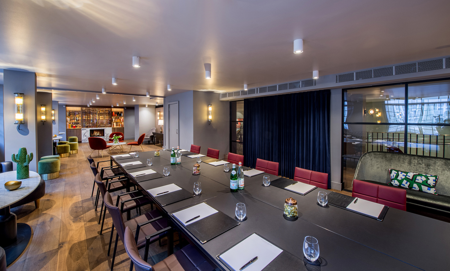 Modern meeting room in The Long Room, featuring a sleek table for corporate workshops.