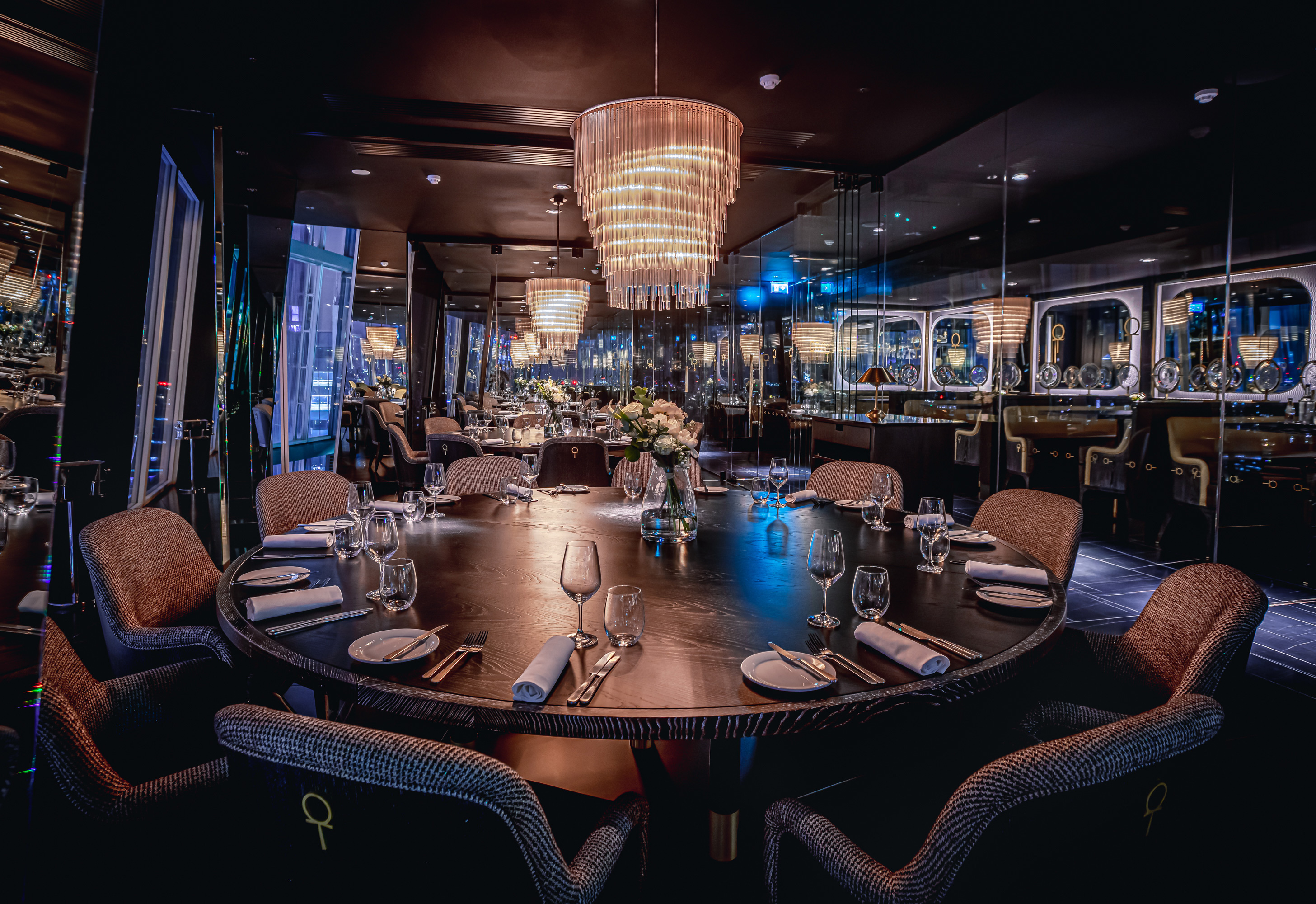 Private dining room at Aqua Shard with round table for upscale corporate events.