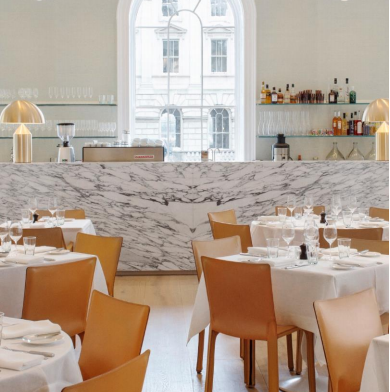 Sophisticated dining venue with marble bar, ideal for corporate events and meetings.