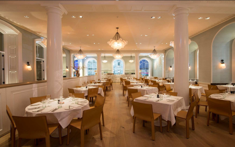 Elegant dining venue with natural light, perfect for corporate events and private gatherings.