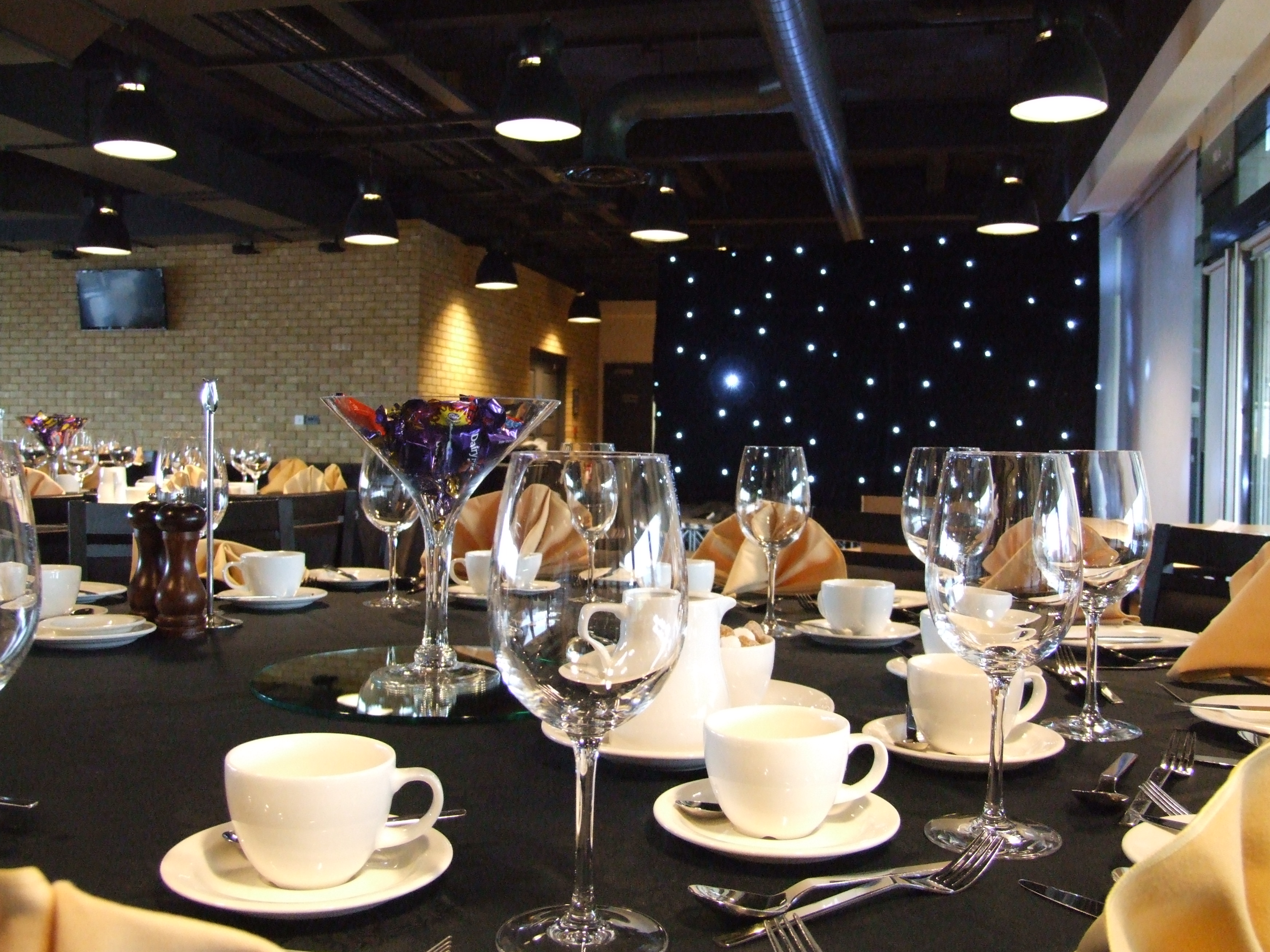 Elegant dining setup at Molineux Stadium for corporate events and celebrations.