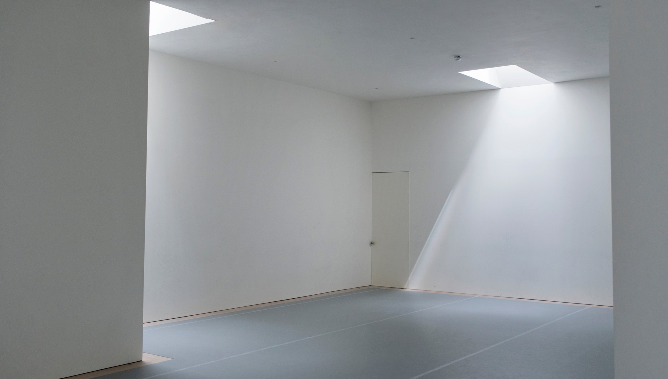 Minimalist event space with natural light in Studio Wayne McGregor for workshops and exhibitions.